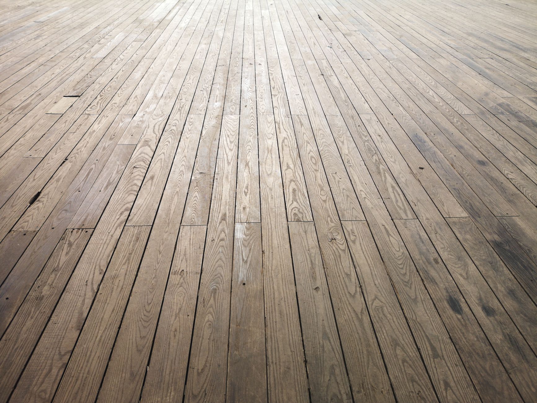 Natural wood plank flooring with rich grain detail